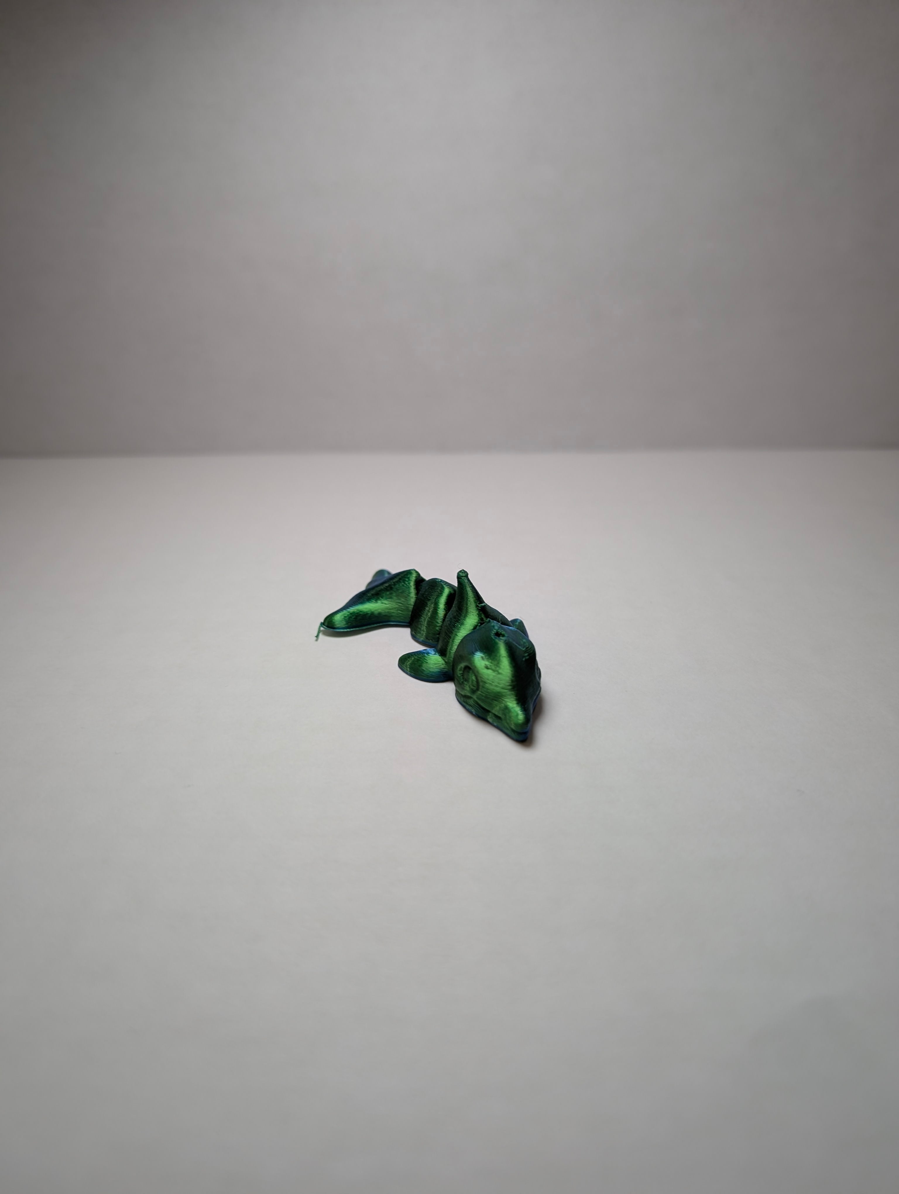 The Emerald Flexi-Dolphin – Your Desk’s New Splash of Color