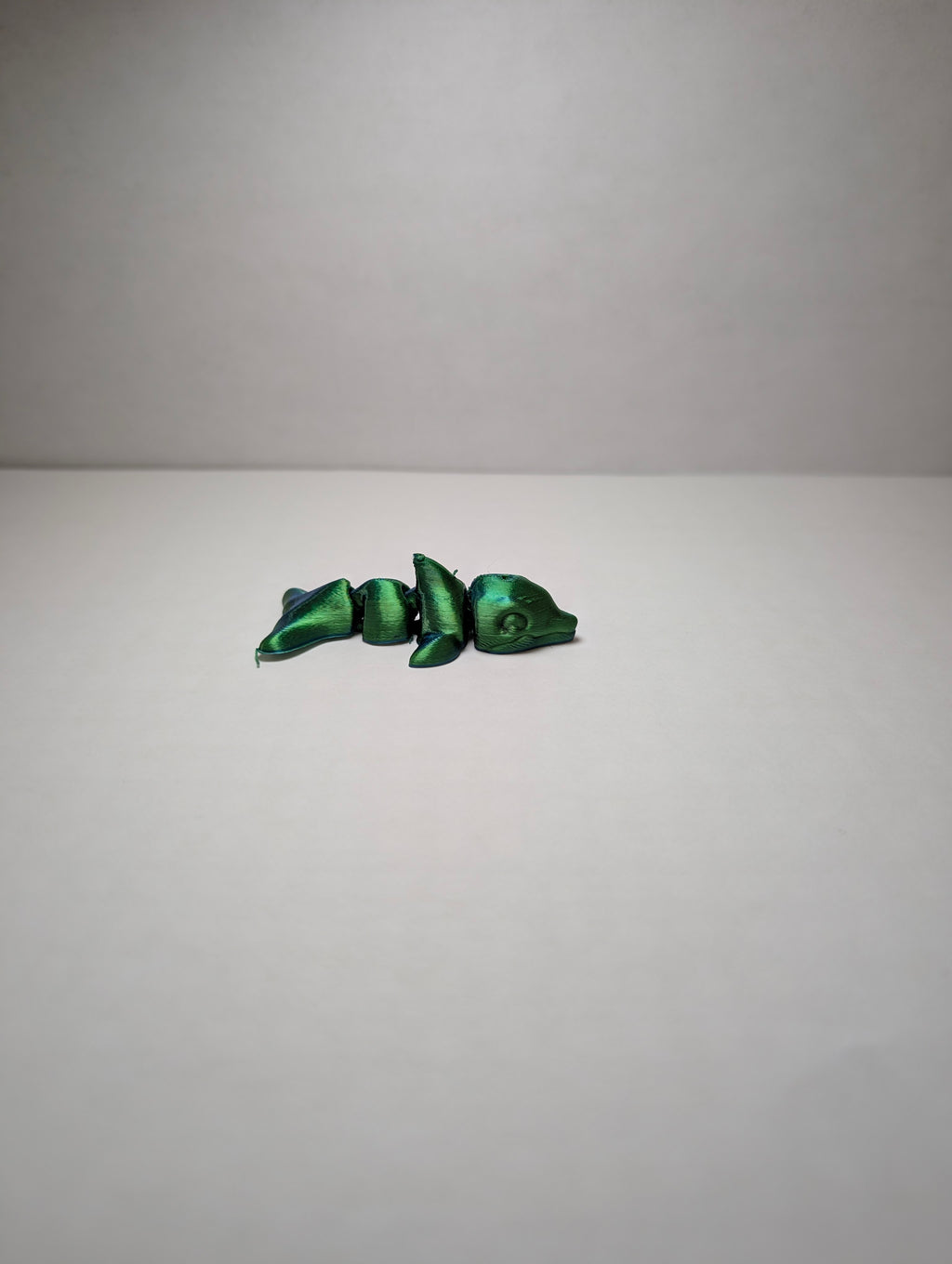 The Emerald Flexi-Dolphin – Your Desk’s New Splash of Color