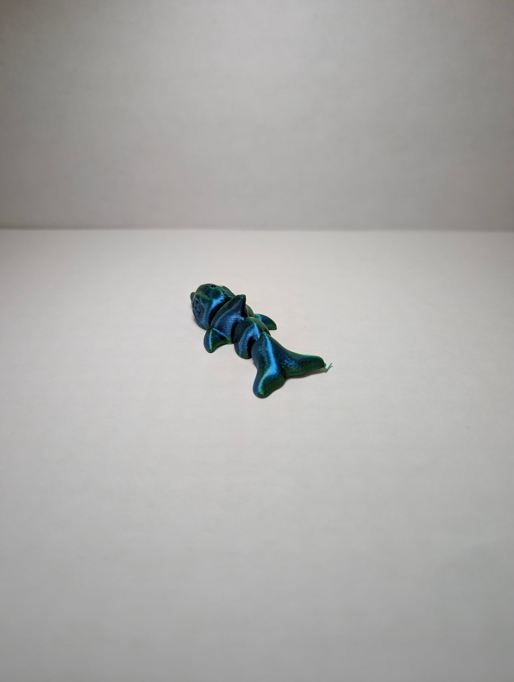 The Emerald Flexi-Dolphin – Your Desk’s New Splash of Color