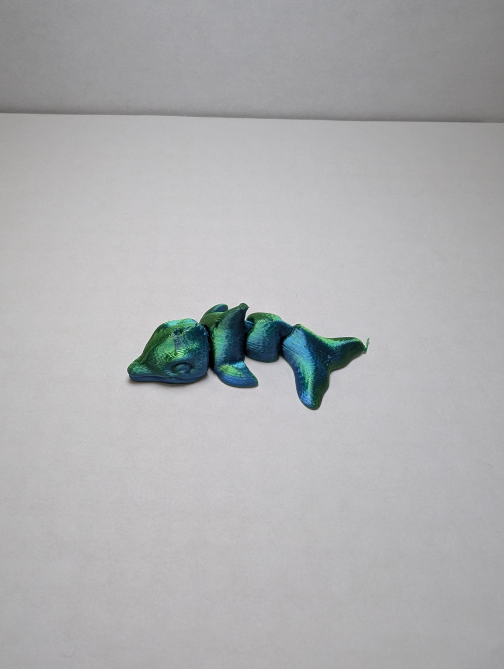 The Emerald Flexi-Dolphin – Your Desk’s New Splash of Color