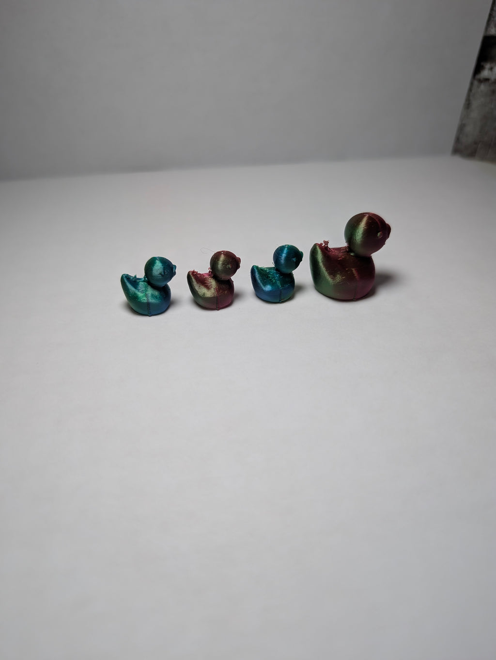 The Shimmering Duck Squad – A Tiny, Iridescent Family