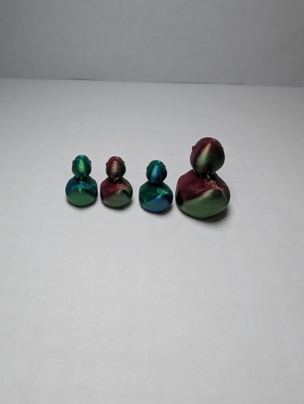 The Shimmering Duck Squad – A Tiny, Iridescent Family