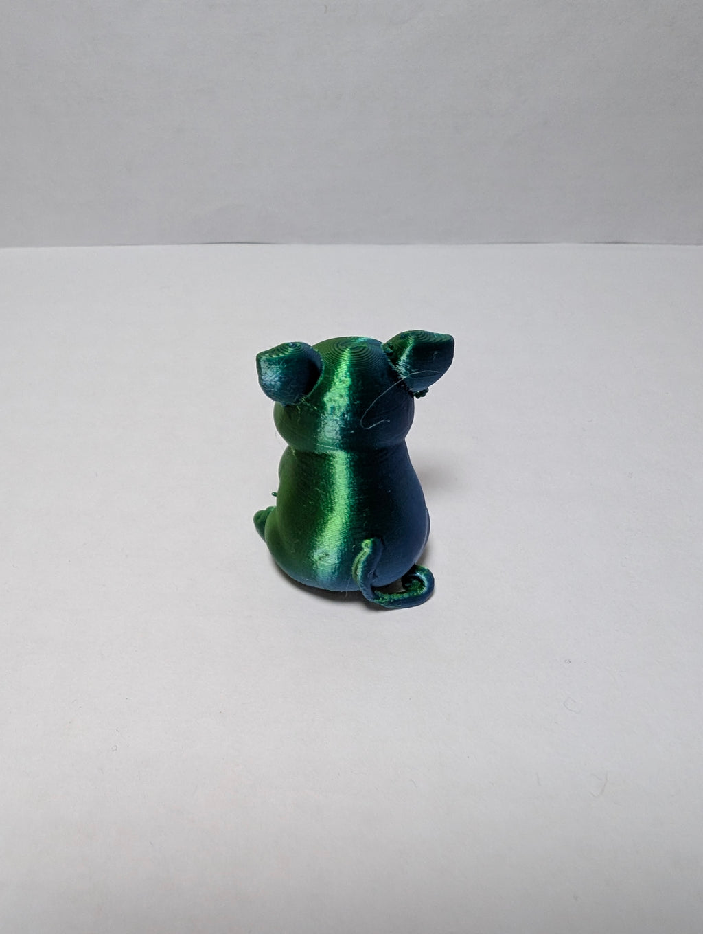 The Emerald Sitting Piglet – A Shiny Spot of Good Luck