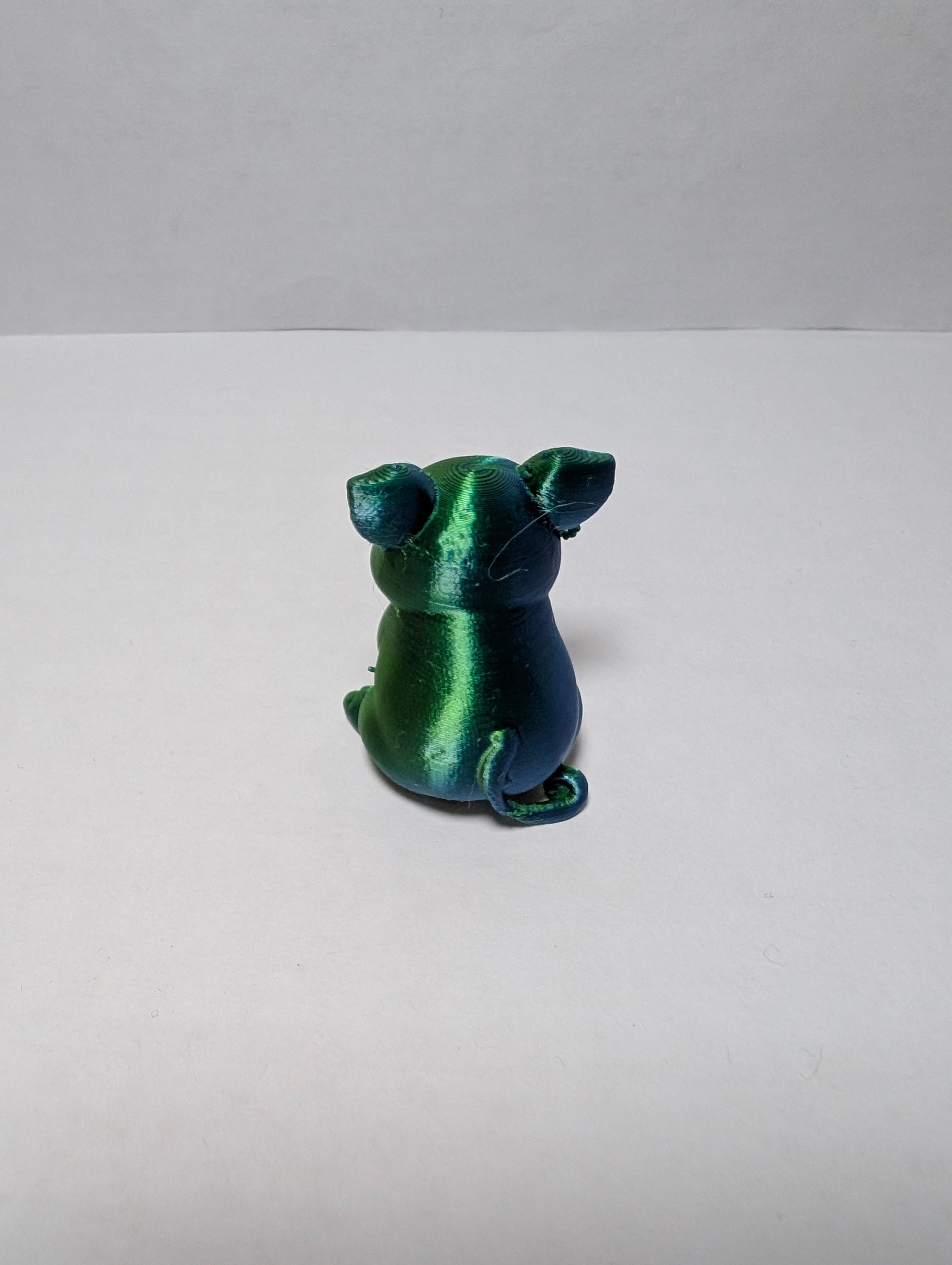 The Emerald Sitting Piglet – A Shiny Spot of Good Luck